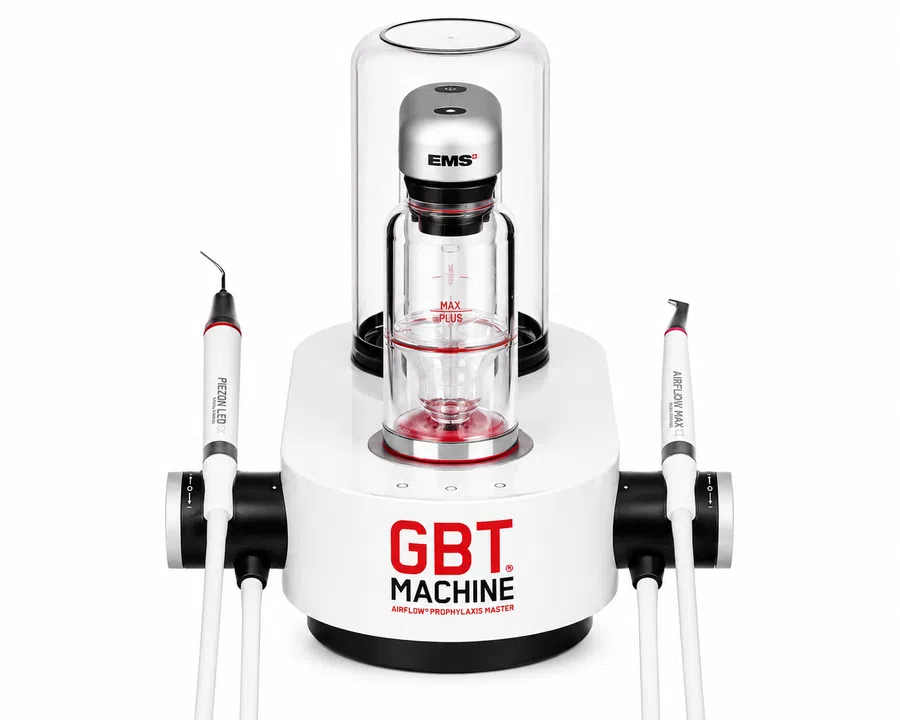 GBT Machine by EMS, a dental airflow prophylaxis device with handpieces and a transparent chamber on a white base.