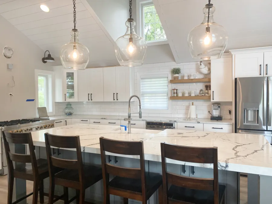 a kitchen with a table and chairs