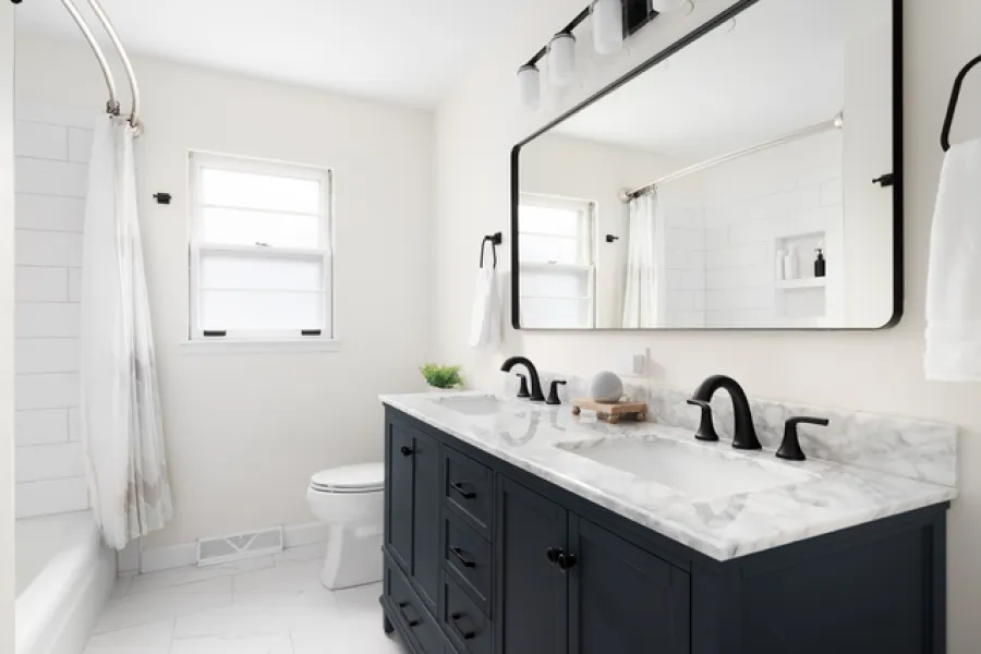 a bathroom with a large mirror