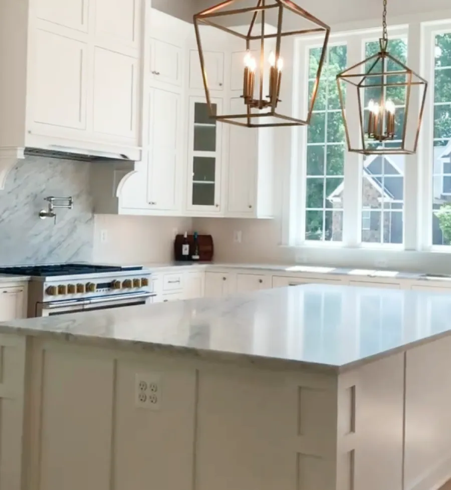 a kitchen with white cabinets