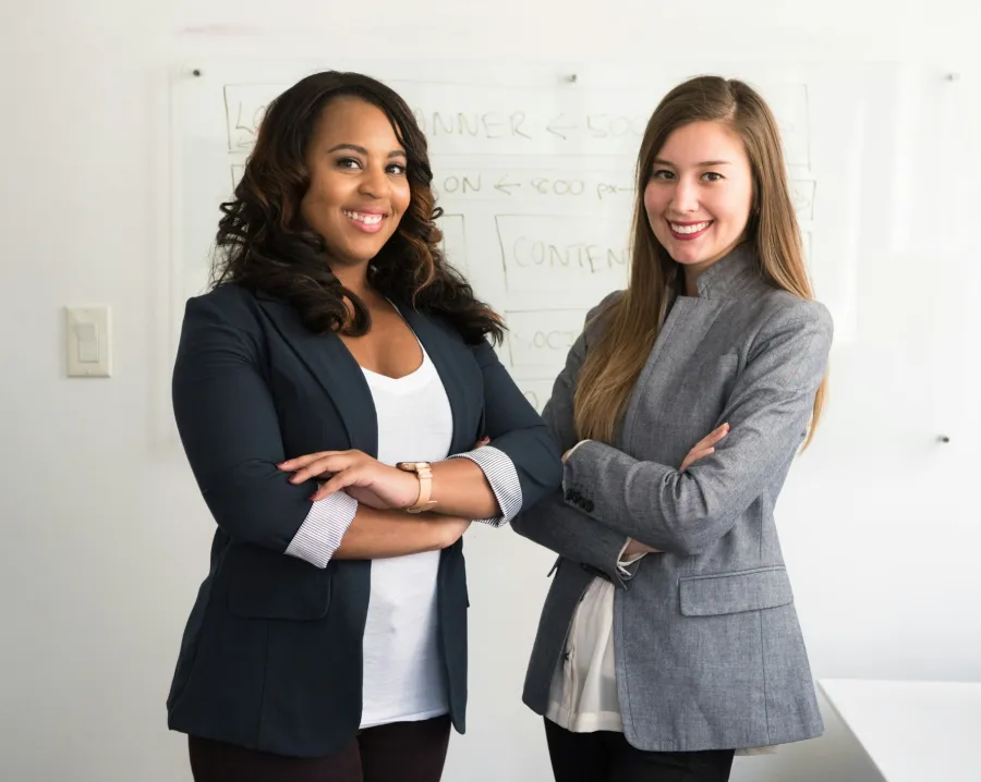 a couple of women smiling