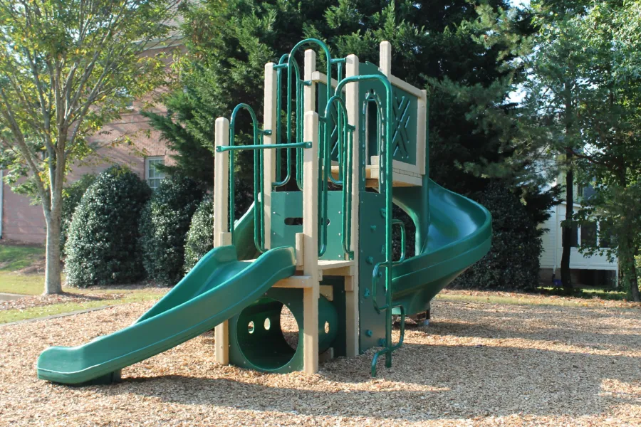 a green playground slide