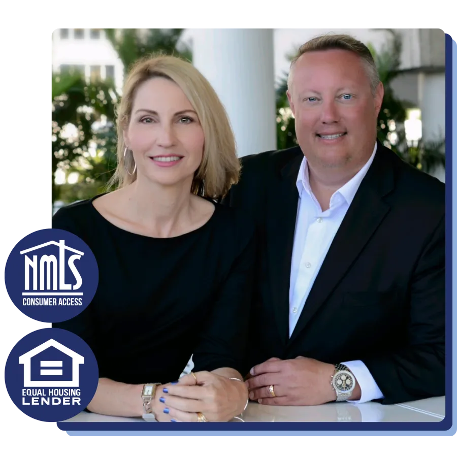 Smiling professional man and woman seated at a table in business attire with housing lender logos