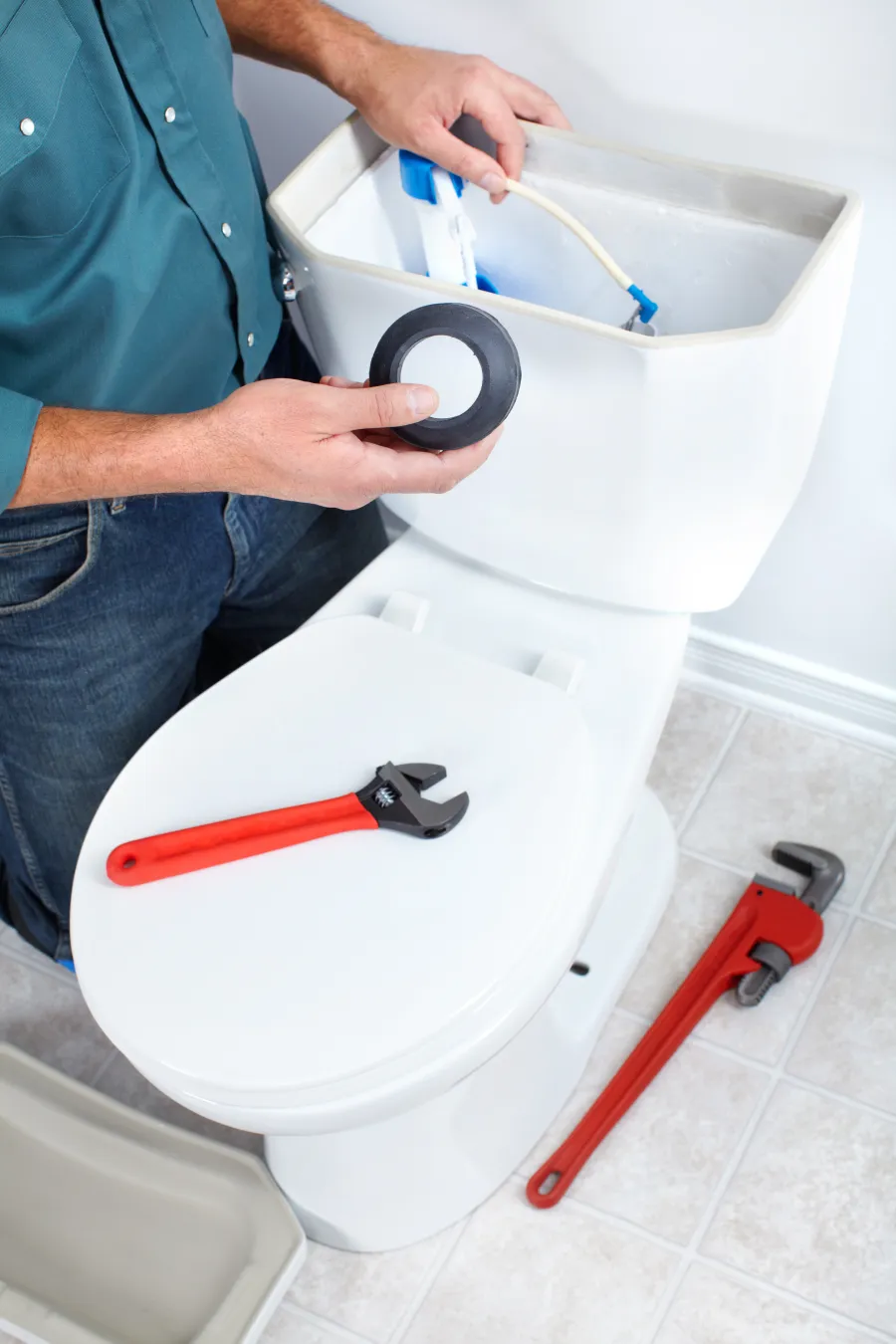 a person washing a toilet