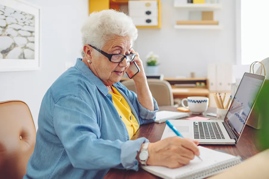a woman sitting next to a woman