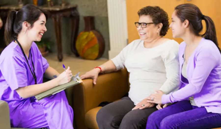 a few women sitting on a couch