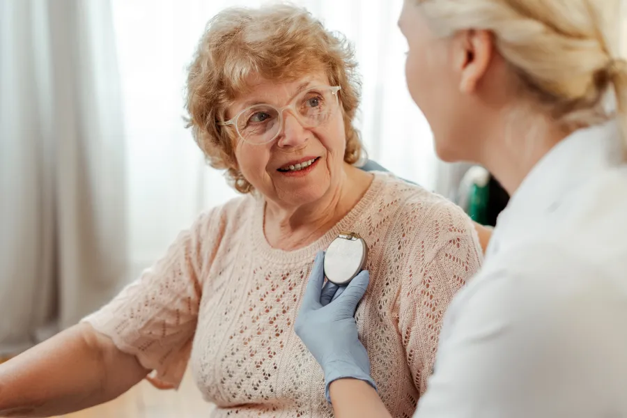 a doctor talking to an old woman