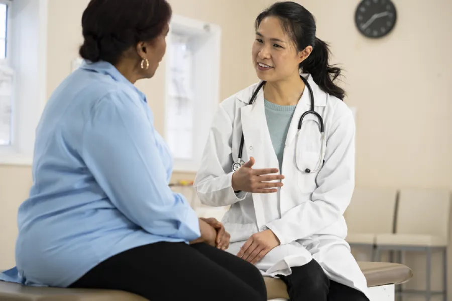 a doctor talking to a patient