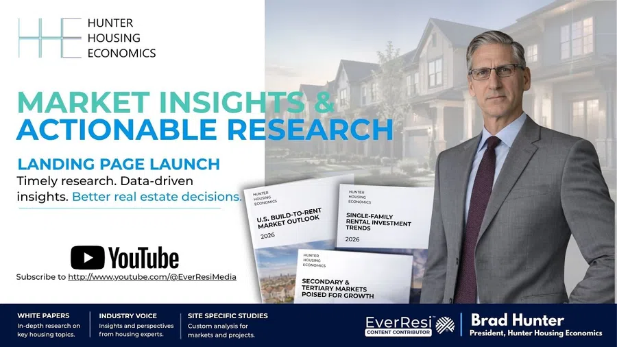 Business professional beside text promoting Hunter Housing Economics market insights, research, and white papers.