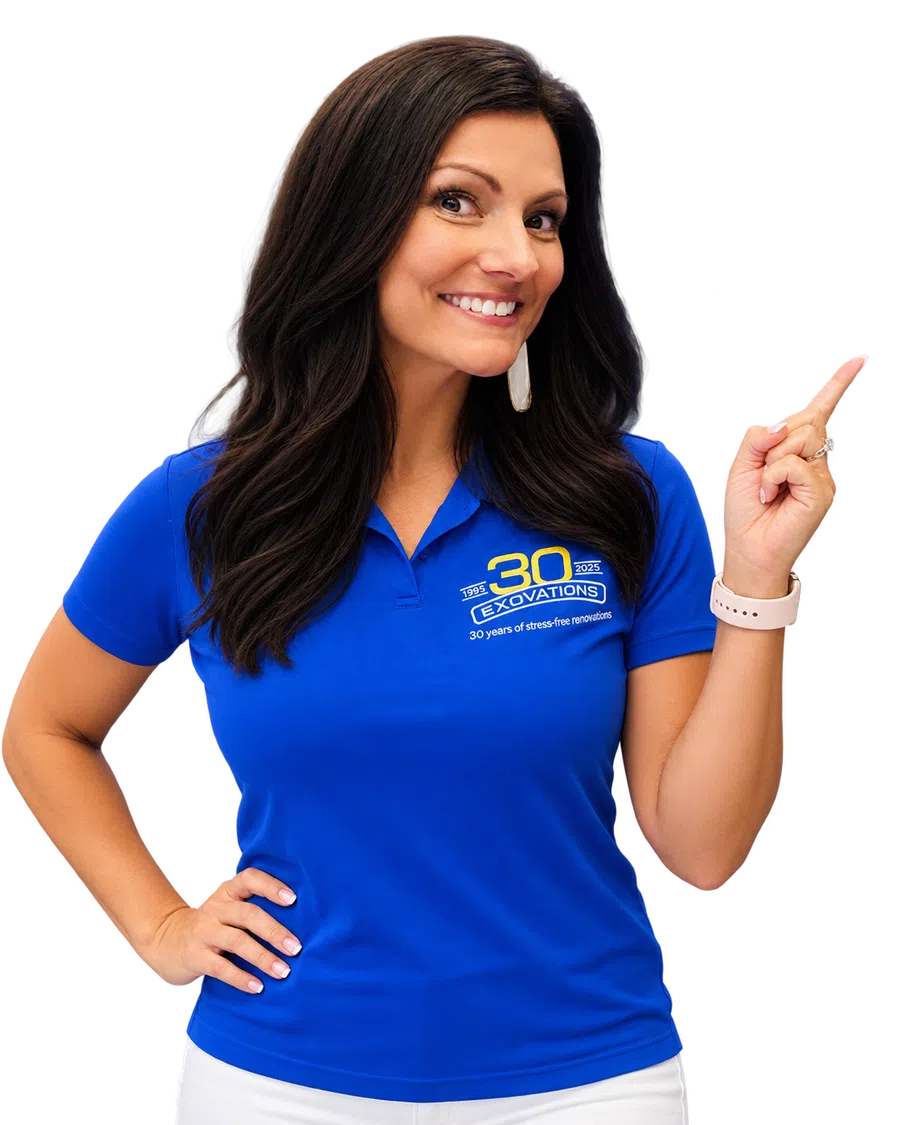 Smiling woman in a blue polo shirt pointing to the side with a 30 years renovation company logo.