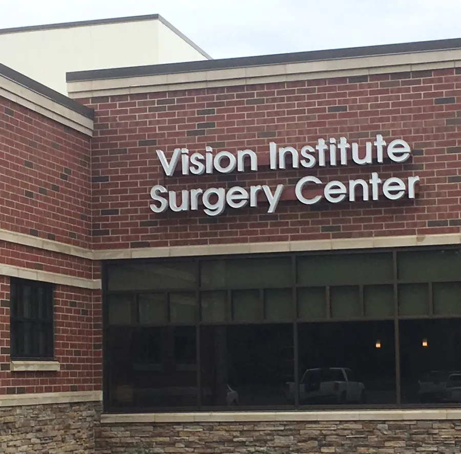 a brick building with a sign on it