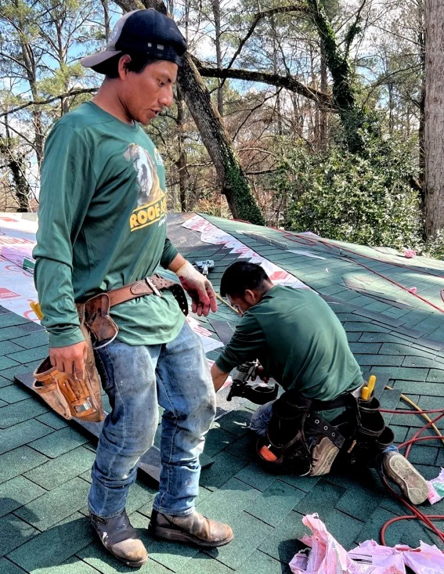 two men working on a roof