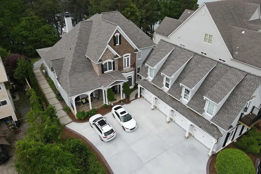 a couple of cars parked in front of a house