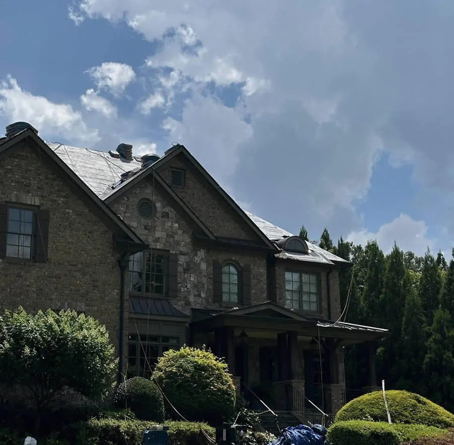 a large house with trees in the front