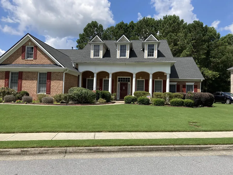 a large house with a lawn in front of it