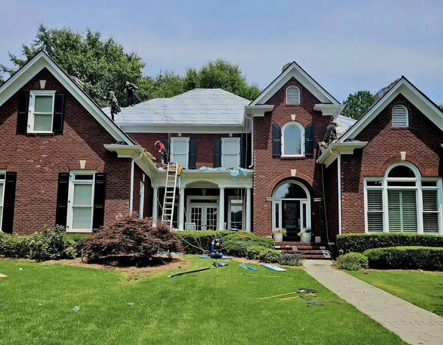 a brick house with a lawn