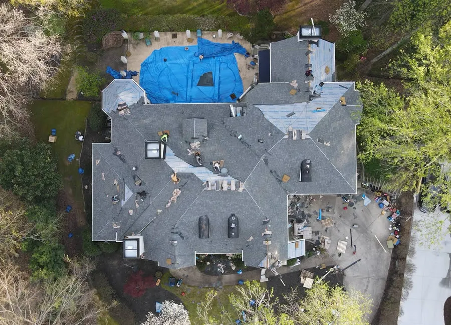 a house with a pool and people around it