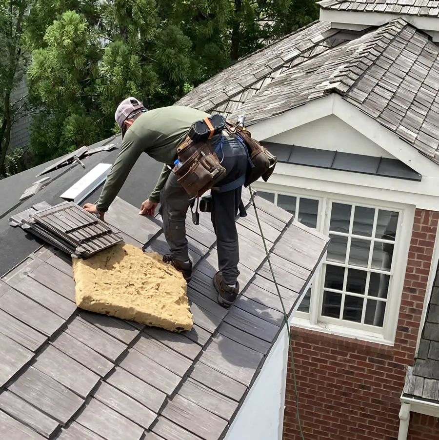 a couple of men on a roof