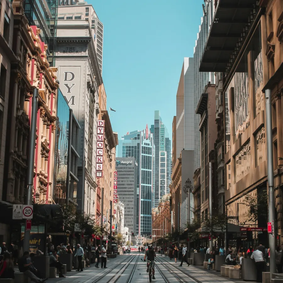 a city street with people walking