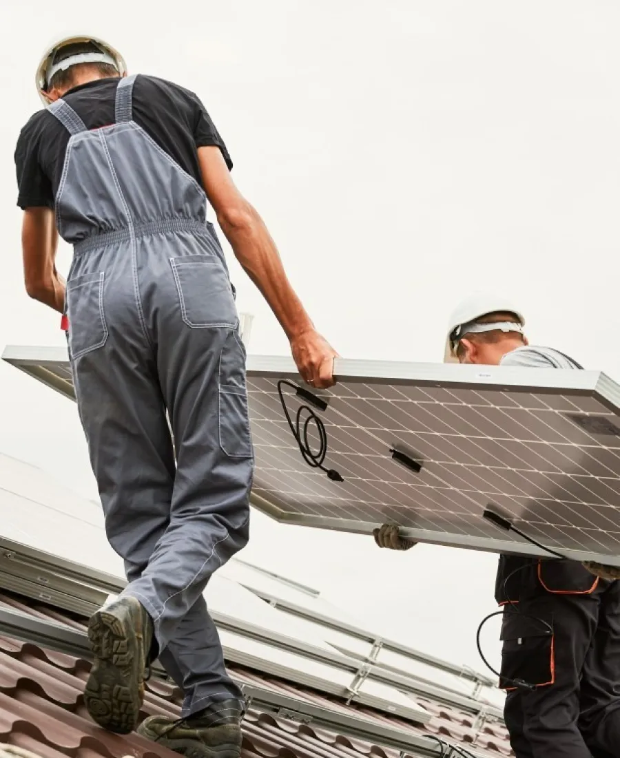 A team of men installing solar panels