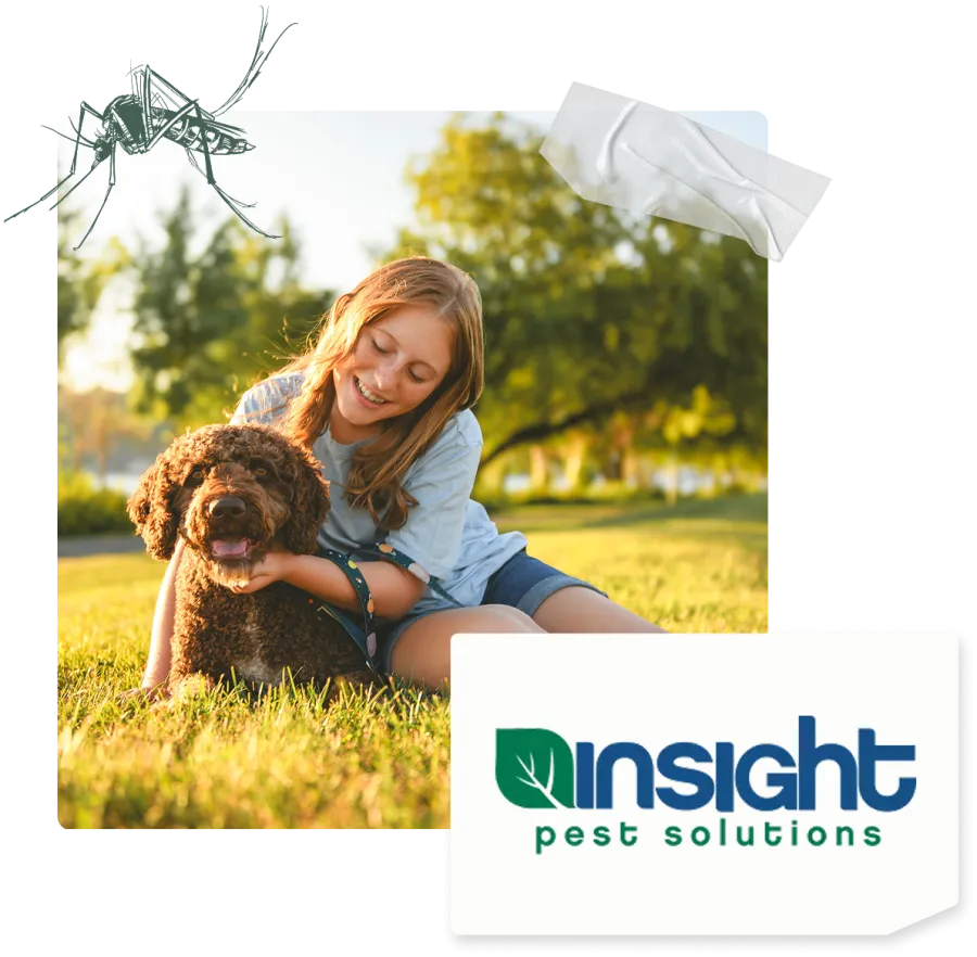 Young girl happily sitting on grass hugging her dog outdoors with trees in the background and a mosquito above.