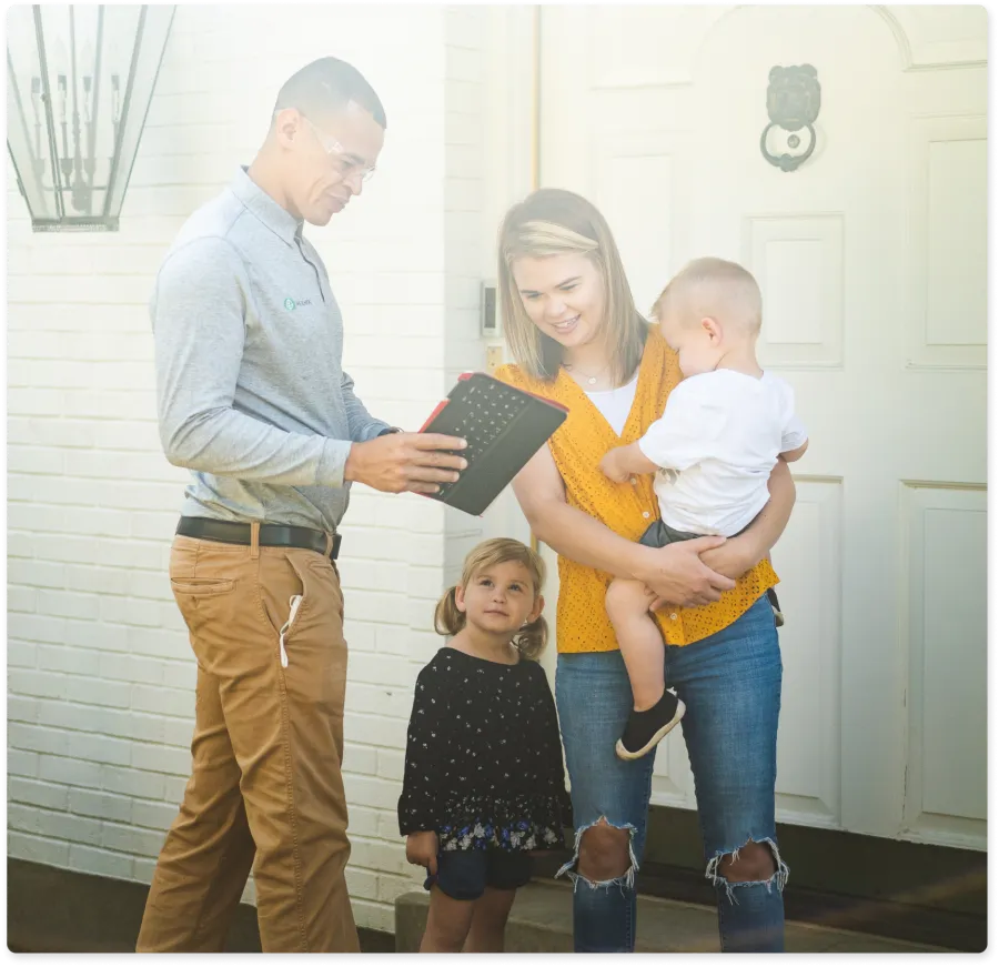 Mari Samuelsen et al. holding a couple children