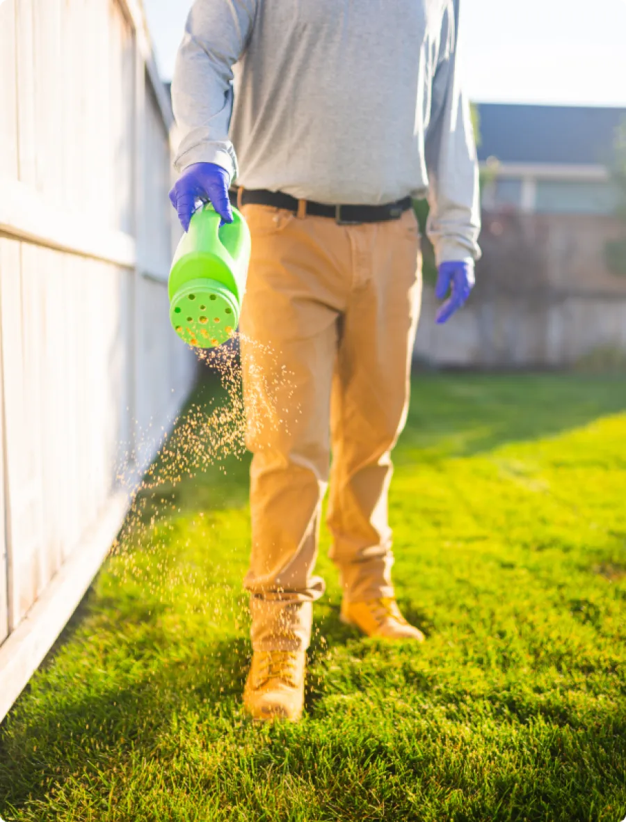 a man using pesticide outdoors