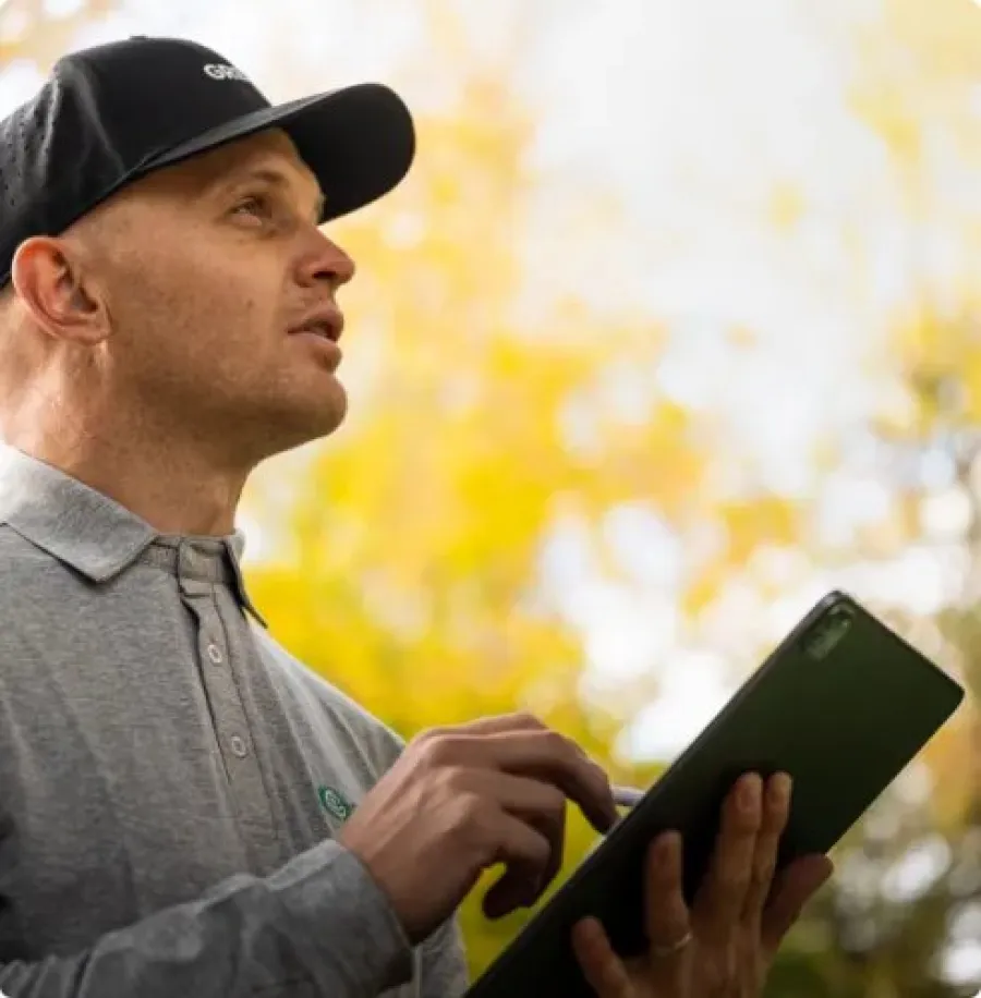 a technician holding a tablet