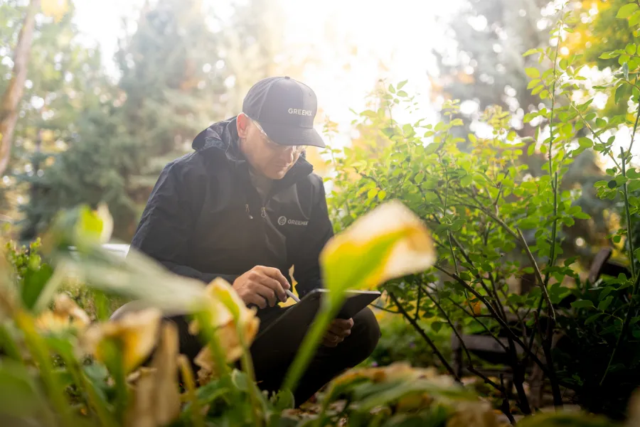Service technician inspecting a home for carpenter bees.