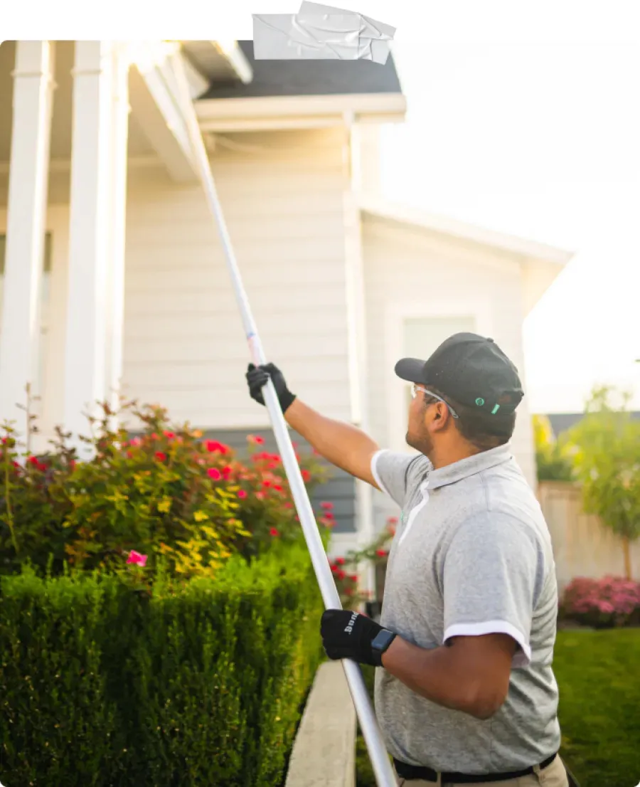 a man holding a white pole