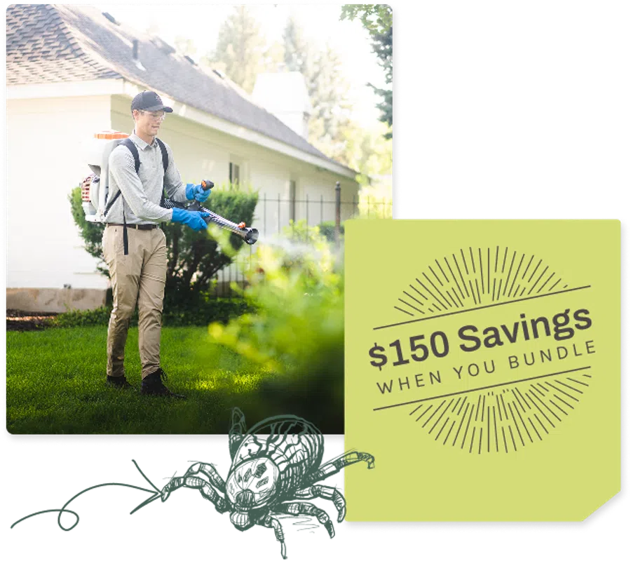Man wearing protective gear spraying pesticides on lawn in front of house during daytime.