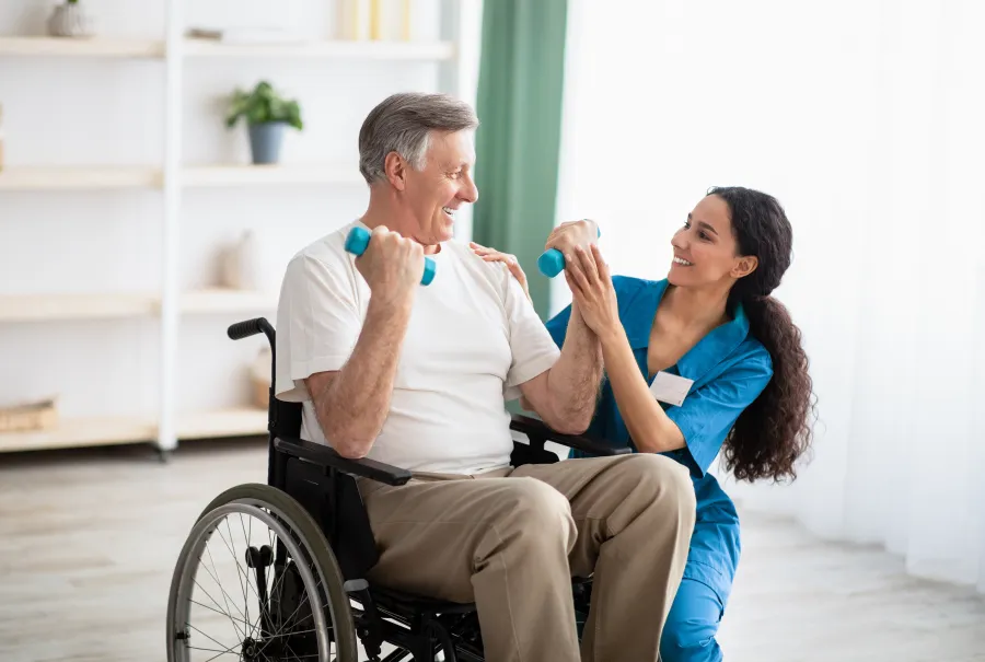 a woman in a wheelchair talking to a man in a wheelchair