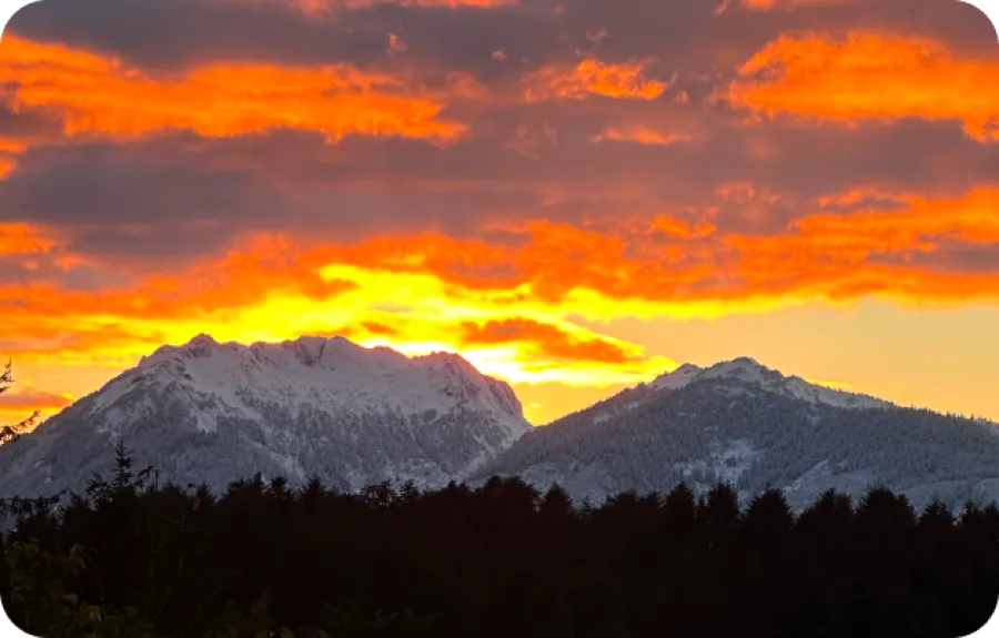 a mountain range with clouds