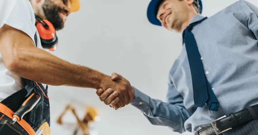 a man shaking hands with another man