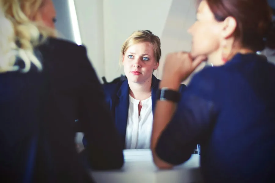 a woman looking at a man