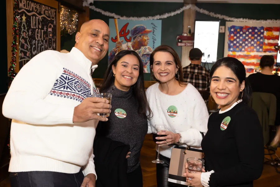 a group of people holding wine glasses