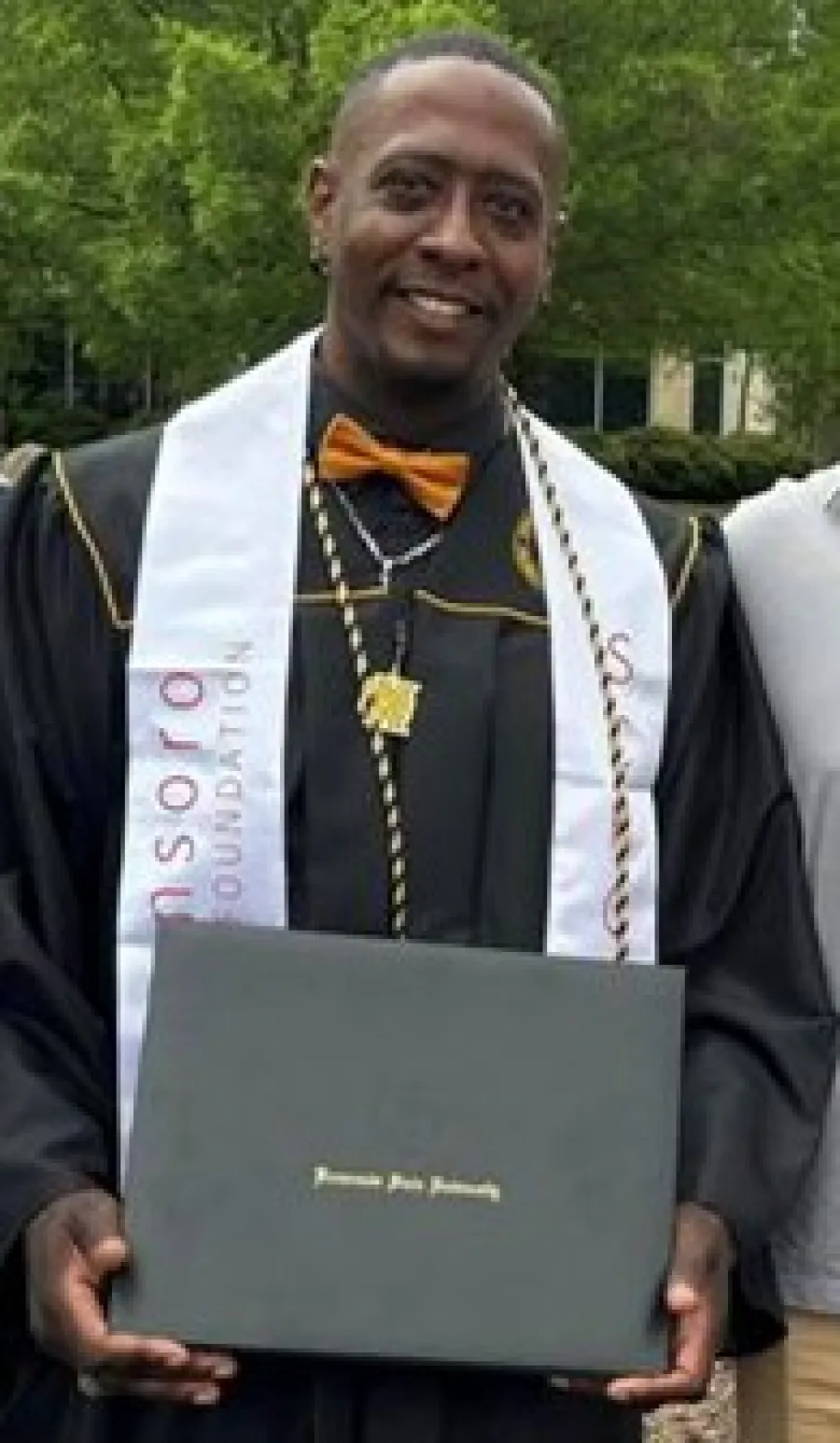 a man holding a laptop