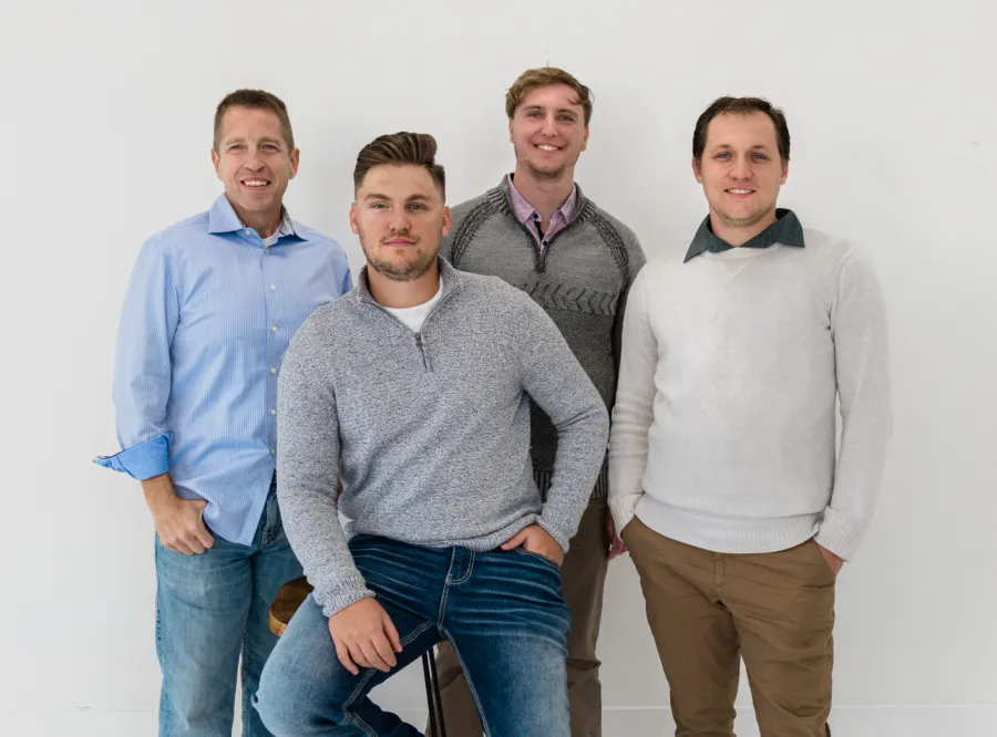a group of men posing for a photo