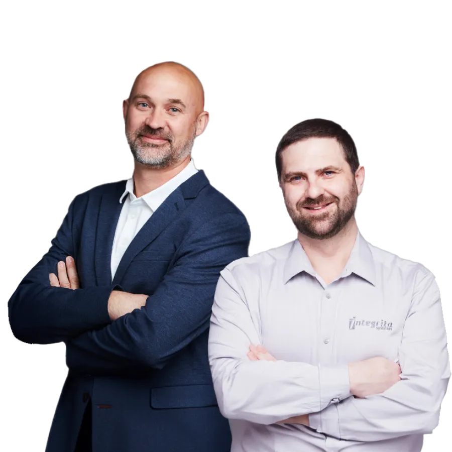 Two confident men standing with arms crossed, one in a navy blazer and the other in a white shirt with logo.