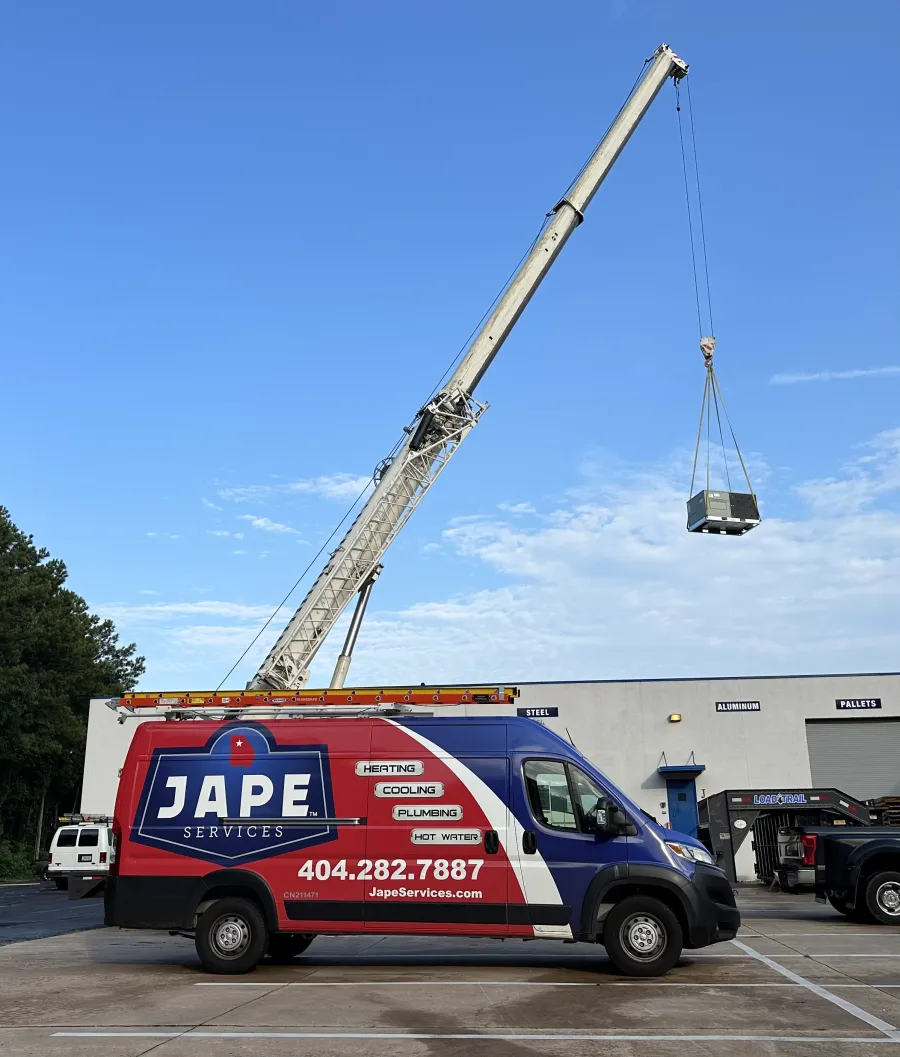 a crane lifting a van