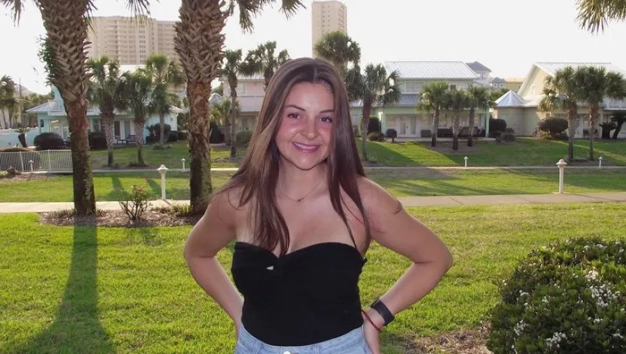 a woman standing in a park