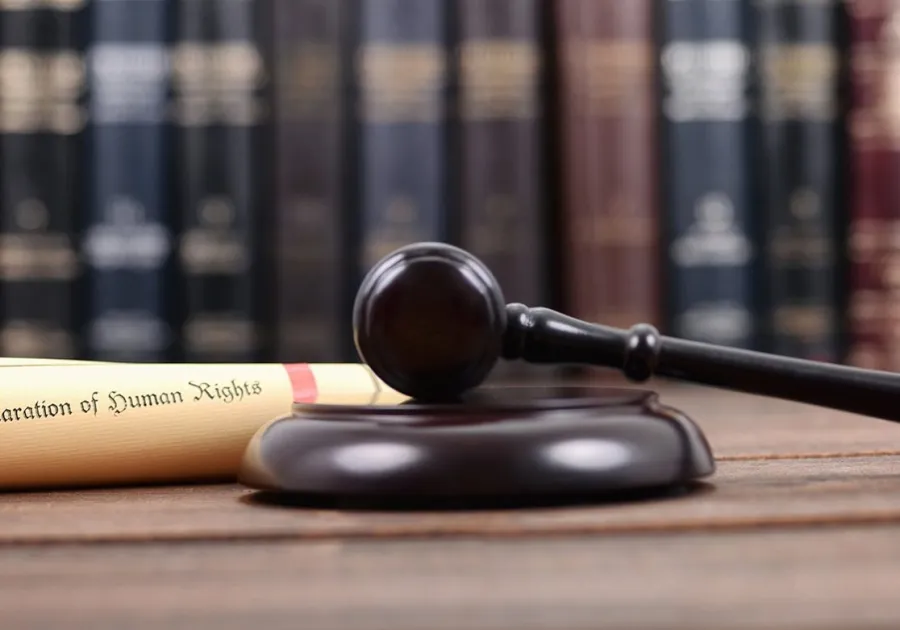 a gavel on a wooden surface