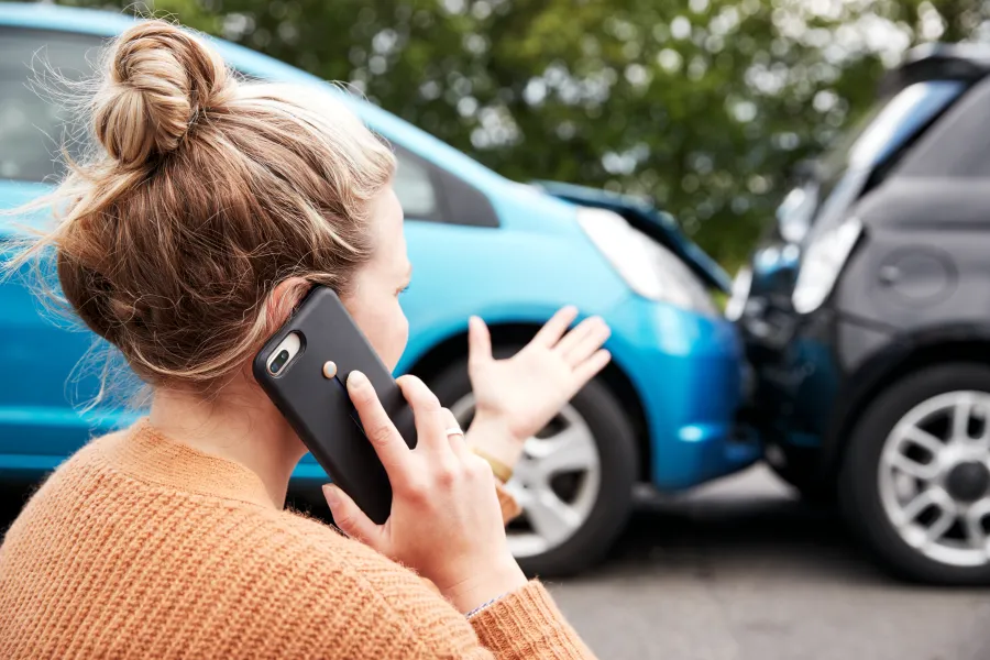 a woman holding a phone