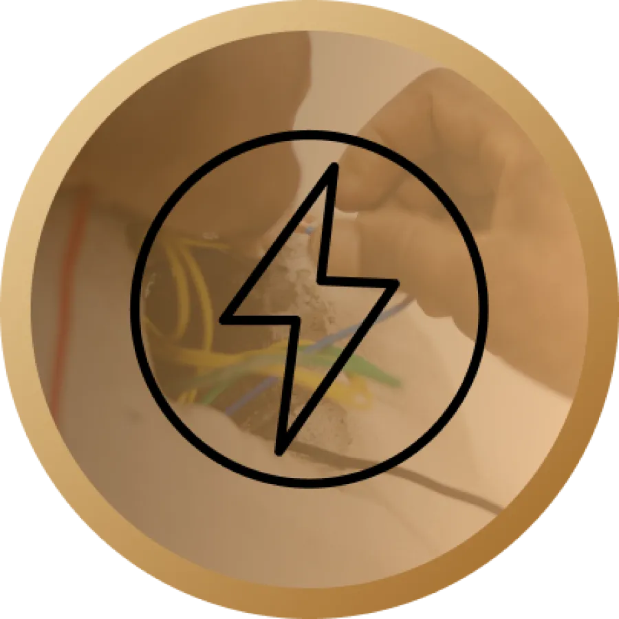 Hand working on electrical wiring with a lightning bolt symbol overlay and a gold circular border