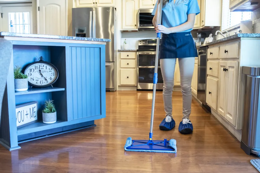 a person standing in a kitchen