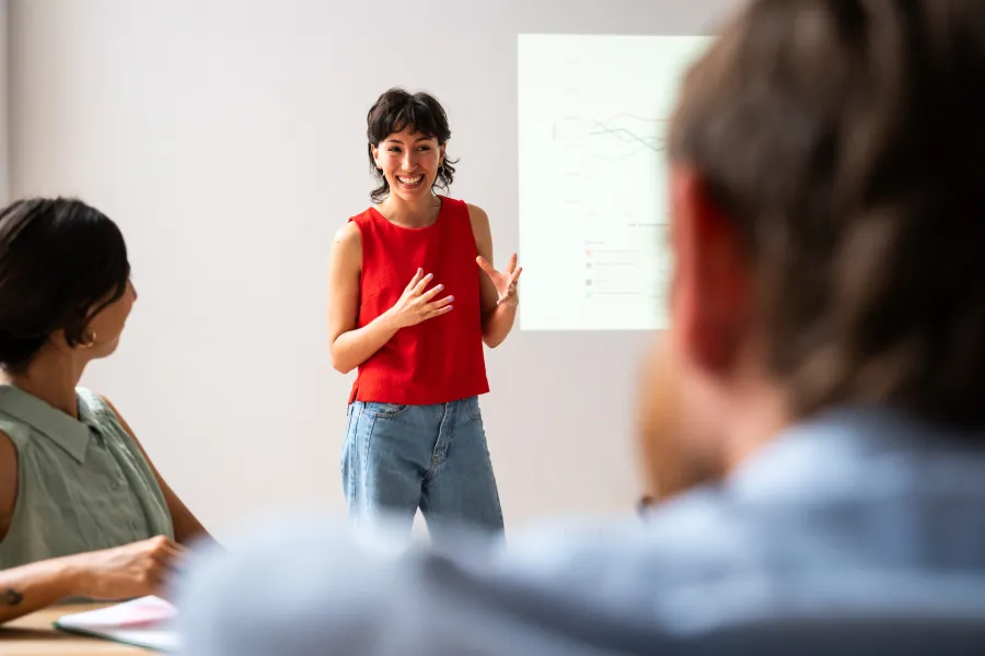 a person standing in front of a group of people