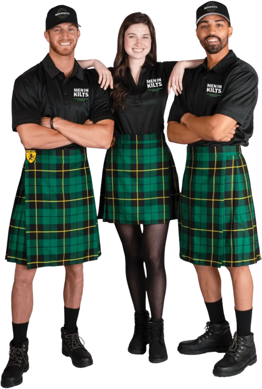 a group of people wearing kilts