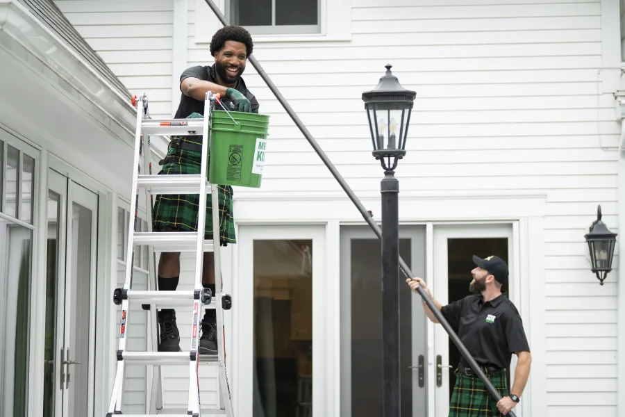 Alan Branch et al. on a ladder