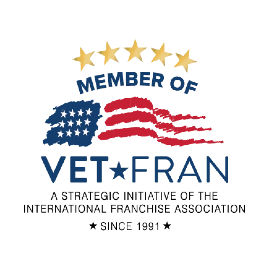 Logo with five gold stars above text Member of VetFran featuring a stylized American flag.