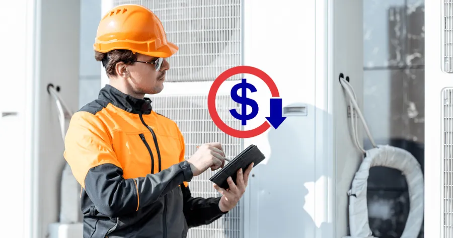 a man wearing a hard hat and looking at a tablet
